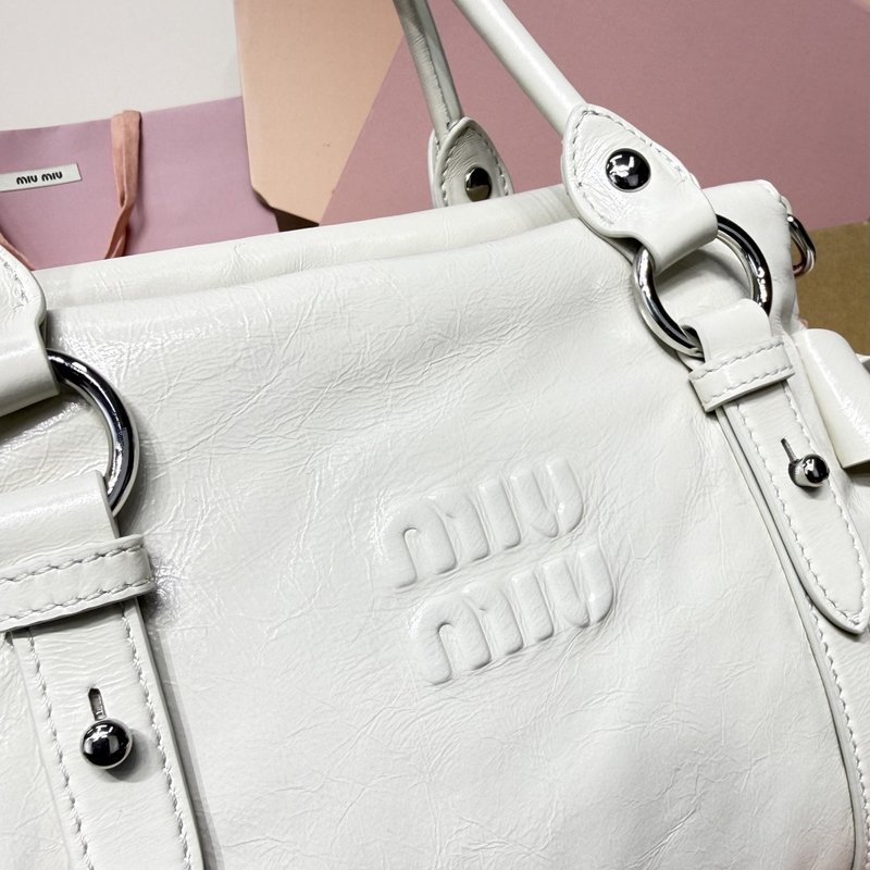 미우미우 복고 오일드 레더 오토바이백 001-248380